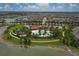 Aerial view of community pool, playground, and surrounding homes at 6428 Devesta Loop, Palmetto, FL 34221