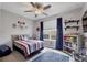 Baseball-themed bedroom with full-size bed and built-in shelves at 6428 Devesta Loop, Palmetto, FL 34221