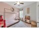 Charming bedroom with a house-shaped bed and pink accents at 6428 Devesta Loop, Palmetto, FL 34221