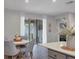 Bright dining area with round table and four gray chairs at 6428 Devesta Loop, Palmetto, FL 34221