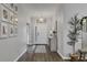 Bright entryway with wood-look floors and gallery wall at 6428 Devesta Loop, Palmetto, FL 34221