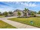 Two-story house with landscaping, driveway, and sidewalk at 6428 Devesta Loop, Palmetto, FL 34221