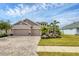 Two-story house with two-car garage and landscaped yard at 6428 Devesta Loop, Palmetto, FL 34221