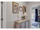 Hallway with decorative cabinet and framed artwork at 6428 Devesta Loop, Palmetto, FL 34221