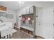 Well-organized laundry room with built-in bench, storage, and a utility sink at 6428 Devesta Loop, Palmetto, FL 34221