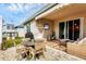 Outdoor patio with seating area, dining set, and a hanging chair at 6428 Devesta Loop, Palmetto, FL 34221