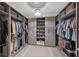 Large walk-in closet with ample shelving and hanging space at 6428 Devesta Loop, Palmetto, FL 34221