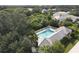 Community pool with surrounding homes and lush landscape at 6669 Windjammer Pl, Lakewood Ranch, FL 34202