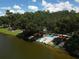 Kayaks and canoes are lined up by the lake at a community at 6669 Windjammer Pl, Lakewood Ranch, FL 34202