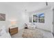 Serene bedroom with comfy seating area and large window with natural light at 6669 Windjammer Pl, Lakewood Ranch, FL 34202