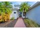 Inviting entryway with double doors and a brick pathway at 6669 Windjammer Pl, Lakewood Ranch, FL 34202