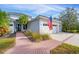 Beautiful home exterior with a two-car garage and manicured landscaping at 6669 Windjammer Pl, Lakewood Ranch, FL 34202