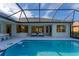 Inviting pool area with a covered patio and lounge chairs at 6669 Windjammer Pl, Lakewood Ranch, FL 34202