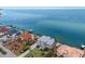 Waterfront property showcasing a beautiful home and neighboring houses at 709 Key Royale Dr, Holmes Beach, FL 34217