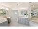 Elegant bathroom with double vanity and large mirrors at 709 Key Royale Dr, Holmes Beach, FL 34217