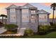 Grand three-story home with stone facade and welcoming staircase at 709 Key Royale Dr, Holmes Beach, FL 34217