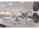 Kitchen features a double sink, white countertops, and views of the living room at 709 Key Royale Dr, Holmes Beach, FL 34217