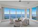 Relaxing living room with panoramic ocean views and comfy seating at 709 Key Royale Dr, Holmes Beach, FL 34217