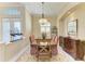 Formal dining room with a large wooden table and sideboard at 7215 Treymore Ct, Sarasota, FL 34243