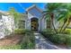 Attractive single-story home with a well-manicured lawn and lush landscaping at 7215 Treymore Ct, Sarasota, FL 34243