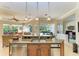 Kitchen island with granite countertop, sink, and stainless steel dishwasher at 7215 Treymore Ct, Sarasota, FL 34243