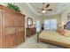 Main bedroom with king-size bed and ample wood furniture at 7215 Treymore Ct, Sarasota, FL 34243