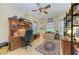 Home office with built-in desk and bookshelves, plus a comfortable sitting area at 7215 Treymore Ct, Sarasota, FL 34243