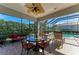 Covered patio with seating overlooking the pool at 7215 Treymore Ct, Sarasota, FL 34243