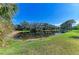 Serene pond with lush greenery and palm trees at 7215 Treymore Ct, Sarasota, FL 34243