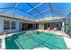 Inviting pool and spa with a covered patio at 7215 Treymore Ct, Sarasota, FL 34243