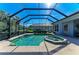 Refreshing pool and spa with screened enclosure at 7215 Treymore Ct, Sarasota, FL 34243