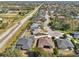 Bird's-eye view of a residential neighborhood showcasing houses near a waterway at 7302 Deer Crossing Ct, Sarasota, FL 34240