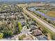 Residential area with houses surrounding a cul-de-sac, near a waterway and road at 7302 Deer Crossing Ct, Sarasota, FL 34240