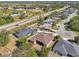 Aerial view showcasing a neighborhood with houses and landscape at 7302 Deer Crossing Ct, Sarasota, FL 34240