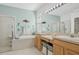 Spa-like bathroom with double vanity, garden tub, and separate shower at 7302 Deer Crossing Ct, Sarasota, FL 34240