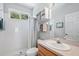 Clean bathroom with shower, toilet, and built-in shelving at 7302 Deer Crossing Ct, Sarasota, FL 34240