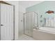 Clean bathroom with a large shower and a linen closet at 7302 Deer Crossing Ct, Sarasota, FL 34240