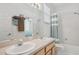 Bathroom with double vanity and shower/tub combo at 7302 Deer Crossing Ct, Sarasota, FL 34240