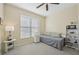 Bright bedroom with a daybed and ample natural light at 7302 Deer Crossing Ct, Sarasota, FL 34240