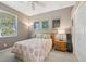 Serene bedroom with coral bedding and wood accents at 7302 Deer Crossing Ct, Sarasota, FL 34240