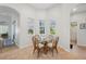 Cozy breakfast nook with glass-top table and chairs at 7302 Deer Crossing Ct, Sarasota, FL 34240