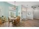 Charming dining room with wooden table and chandelier at 7302 Deer Crossing Ct, Sarasota, FL 34240