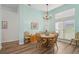 Bright dining room with wooden table and chairs, light walls at 7302 Deer Crossing Ct, Sarasota, FL 34240