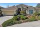 Single-story house with two-car garage and landscaping at 7302 Deer Crossing Ct, Sarasota, FL 34240