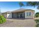 Single-story house with screened porch and landscaped yard at 7302 Deer Crossing Ct, Sarasota, FL 34240