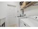 Laundry room with washer, dryer, and extra storage at 7302 Deer Crossing Ct, Sarasota, FL 34240