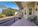 Relaxing screened porch with patio furniture, overlooking backyard at 7302 Deer Crossing Ct, Sarasota, FL 34240