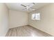 Simple bedroom with wood-look floors and a window at 7930 Verna Bethany Rd, Myakka City, FL 34251