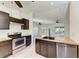 Modern kitchen with stainless steel appliances and island at 7930 Verna Bethany Rd, Myakka City, FL 34251