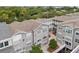 Aerial view of a community with multiple buildings, courtyards, and lush landscaping at 800 S Dakota Ave # 329, Tampa, FL 33606